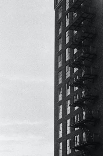 Grayscale photo of Fire Escape Staircase outside a Building · Free Stock Photo