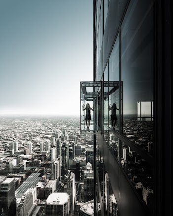 Grayscale Photo of Girl on Building Elevator