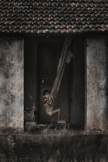 grayscale photo of girl riding hammock