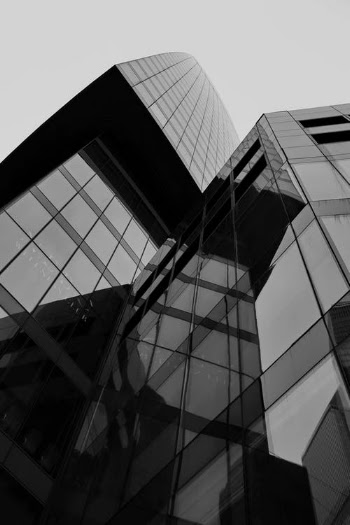 Grayscale Photo of Glass Building · Free Stock Photo