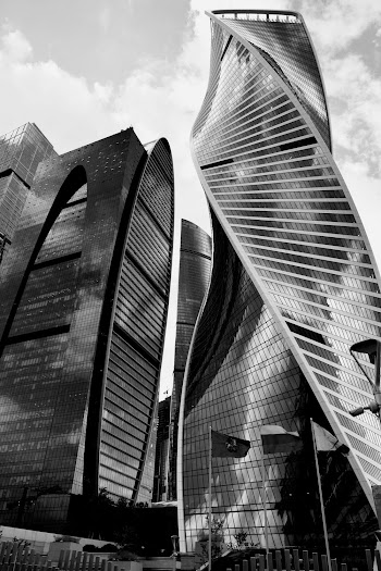 Grayscale Photo of Glass Buildings