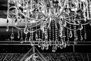 Grayscale Photo of Glass Chandelier