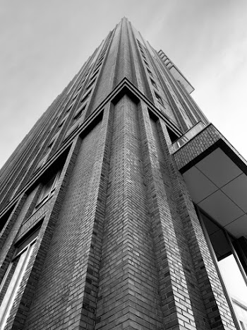 Grayscale Photo of High-rise Building