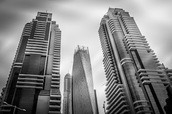 Grayscale Photo of High-rise Buildings
