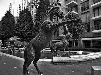 Grayscale Photo of Horse Staue