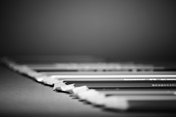 Grayscale Photo of Lined Pencils