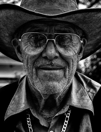 Grayscale Photo of Man in Cowboy Hat
