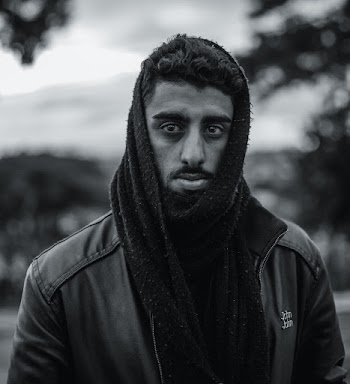 Grayscale Photo of Man in Jacket and Scarf