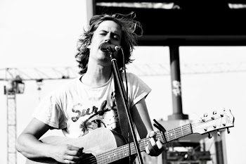 Grayscale Photo of Man Playing Guitar