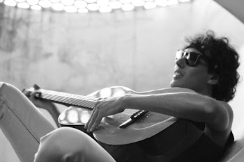 Grayscale Photo of Man Playing Guitar