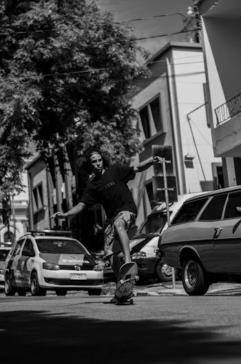 Grayscale Photo Of Man Skating On Street