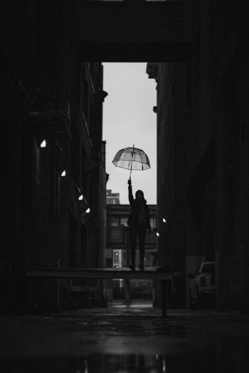 Grayscale Photo of Man Standing on the Street · Free Stock Photo