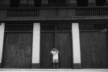 Grayscale Photo of Man Taking Photo