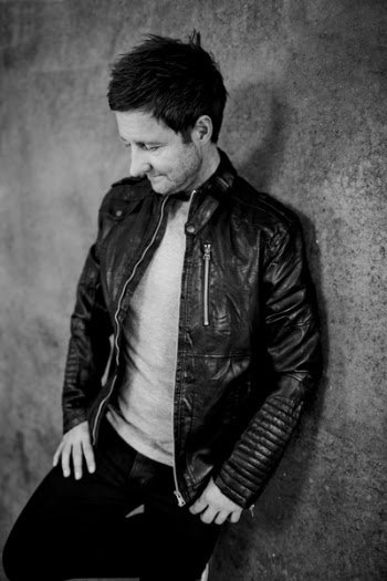 Grayscale Photo of Man Wearing Black Leather Full-zip Jacket
