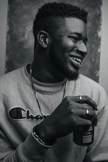 Grayscale Photo of Man Wearing Champion Sweater