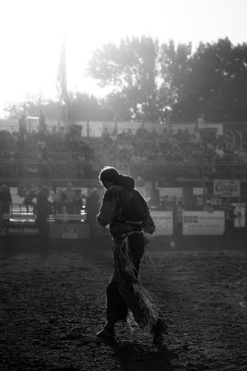 grayscale photo of man wearing cowboy chaps