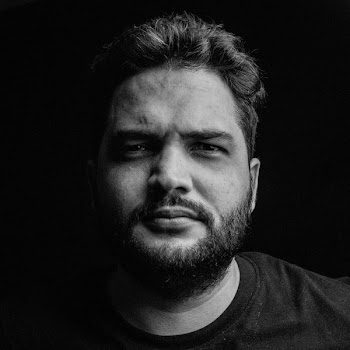 Grayscale Photo of Man Wearing Crew-neck Top