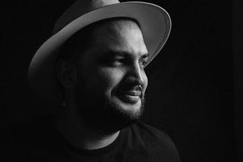 Grayscale Photo of Man Wearing Fedora Hat