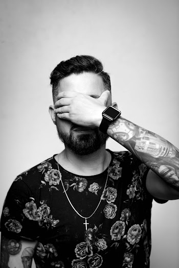 Grayscale Photo of Man Wearing Floral Shirt