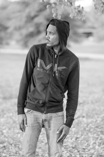 Grayscale Photo of Man Wearing Michael Kors Zip Hoodie Looking on Left