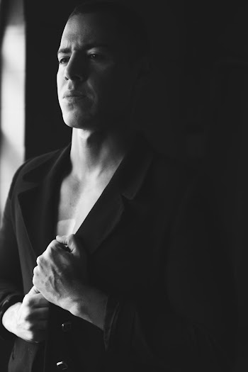 Grayscale Photo of Man Wearing Suit Jacket