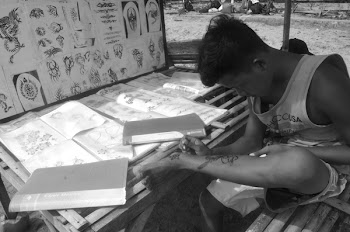 Grayscale Photo of Man Wears Tank Top Sits on Bamboo Chai