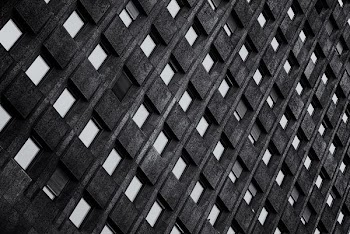 grayscale photo of metal fence