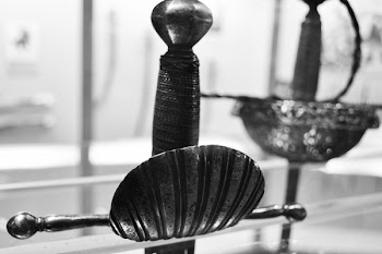 Grayscale Photo of Metal Sword
