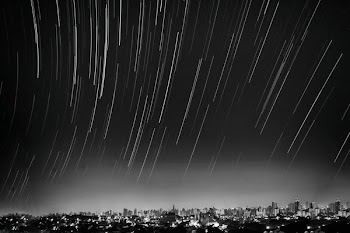 grayscale photo of meteor shower