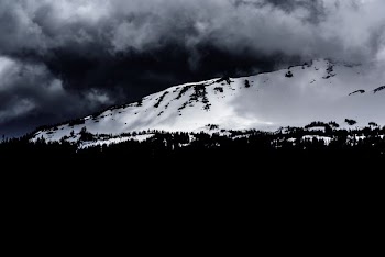 grayscale photo of mountain during winter