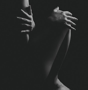 Grayscale Photo of Naked Woman in a Dark Room