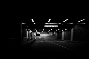 grayscale photo of parking area