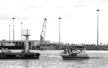 Grayscale Photo of People Riding on Yacht