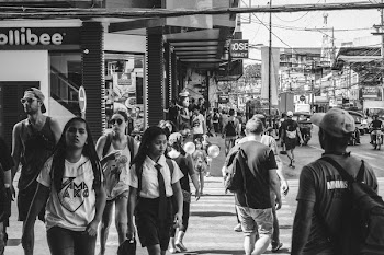 Grayscale Photo of People Walking in the Street