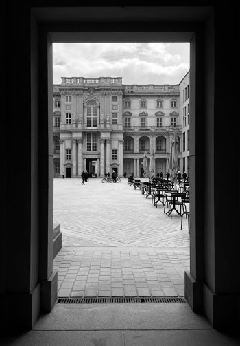 Grayscale Photo of People Walking on Snow Covered Ground in Front of Building · Free Stock Photo
