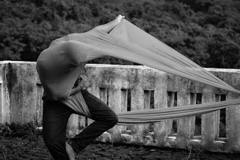 Grayscale Photo of Person Coated With Textile
