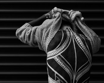 Grayscale Photo of Person Taking Clothes Off
