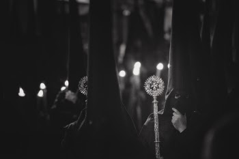 Grayscale Photo of Person Wearing Balaclava Holding Wand
