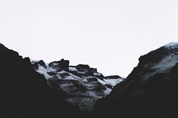 grayscale photo of rock formation