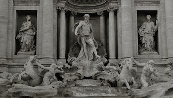 Grayscale Photo of Sculptures