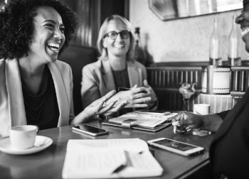 Grayscale Photo Of Smiling Women