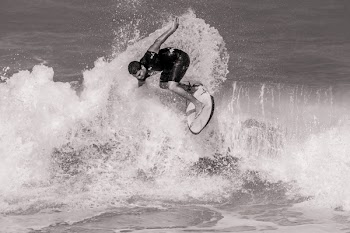 Grayscale Photo of Surfer on Ocean Waves