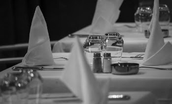 Grayscale Photo of Table Arrangement