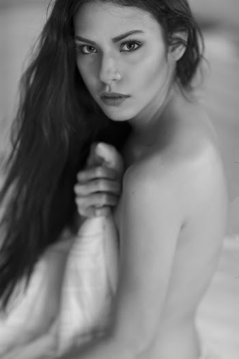 Grayscale Photo of Topless Woman Holding Blanket