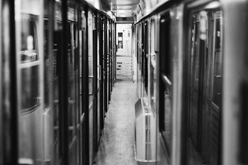 Grayscale Photo of Transit Train
