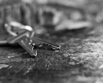Grayscale Photo of Two Keys on Surface