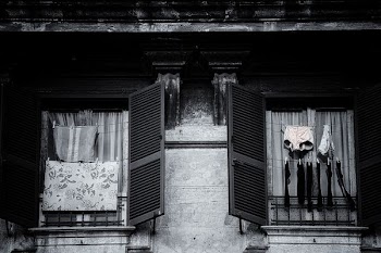 grayscale photo of two open windows