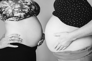 Grayscale Photo of Two Woman Showing Tummies