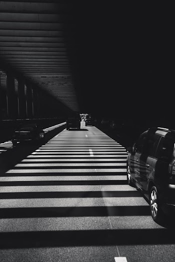 Grayscale Photo of Vehicle Parked