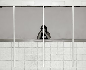 Grayscale Photo of Woman Behind of Windows